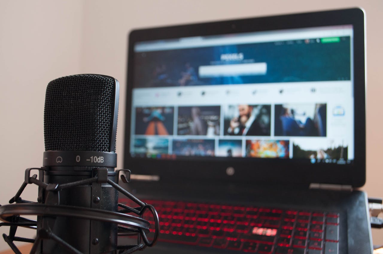 Crafting Captivating Headlines: Your awesome post title goes here Close-up of a microphone and laptop on a desk suitable for home recording or podcasting.
